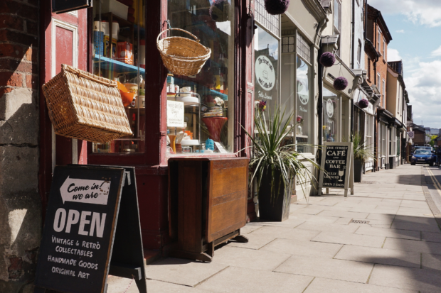 A town's high street, showing small shops.